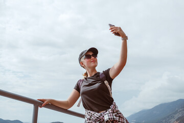 Young woman embracing the freedom of solo travel and digital nomad lifestyle while enjoying a...