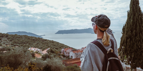 Young woman embracing the freedom of solo travel and digital nomad lifestyle while enjoying a...