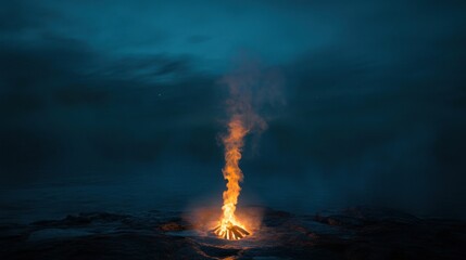 Obraz premium Night bonfire burning brightly on dark beach.
