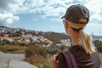 Young woman embracing the freedom of solo travel and digital nomad lifestyle while enjoying a...