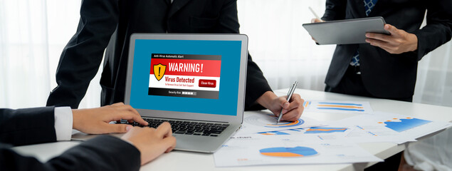 Virus warning alert on computer screen detected brisk cyber threat , hacker, computer virus and...