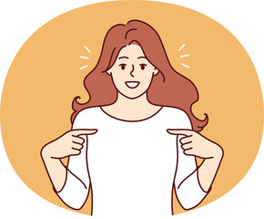 Happy woman pointing finger at t-shirt recommending good laundry detergent or bleach for clothes. Happy girl is proud of own achievements or success in career, and says yes its me.
