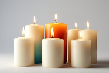 candles are lit and sitting in a row on a table