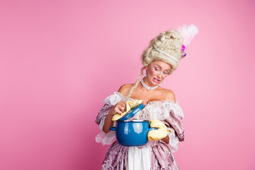 Upset aristocratic woman in baroque dress inspecting pot against a pink background in humorous and satirical interpretation