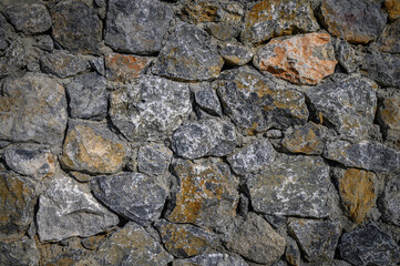 Elegant texture of weathered stone wall in natural tones reflecting age and character