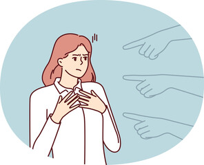 Hands pointing at puzzled girl for concept blame and condemnation person who made mistake. Unhappy girl suffers from unreasonable blame of colleagues or friends motivated by hatred or discrimination