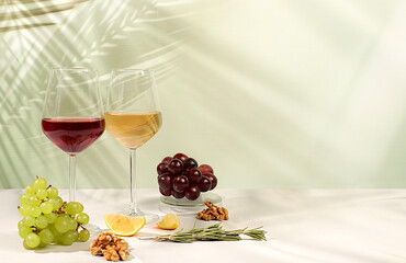 Modern still life with glasses of white and red wine, alcoholic cocktail Margarita and grapes on...
