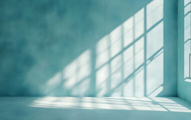 Obraz premium Minimalist light blue plaster wall with natural shadows from a window, perfect for product presentation