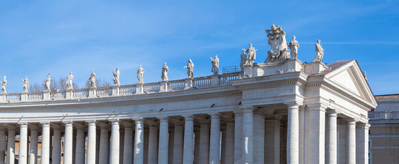 Decorative statues by the architrave surrounding St. Peter's Square.