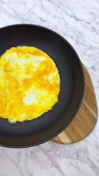 Breakfast fried and scrambled eggs, with sourdough bread.