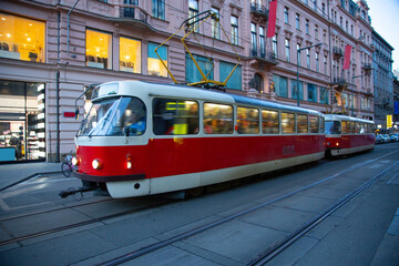 Tram in the center of the modern and bustling city of Prague at night