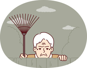 Elderly envious man neighbor peeps from behind fence spying on residents of private house. Envious male pensioner with rake looking at screen suspiciously for bad neighborhood concept.