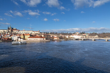 Fototapeta premium Sunset in Prague city on a river in the middle of a touristic medieval city