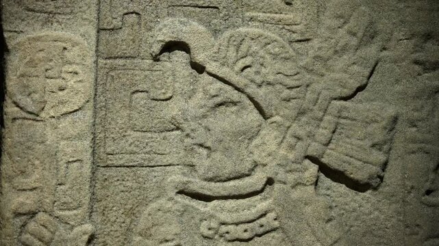 Ancient Olmec petroglyphs carved into stone, showcasing intricate symbols and sacred imagery from Mesoamerican civilization.