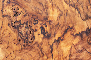 Detailed texture of olive wood board as background