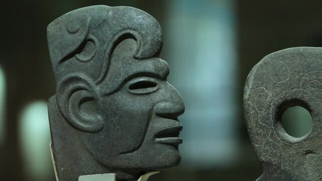 Olmec stone sculpture, depicting intricate symbols and sacred images of the Mesoamerican civilization.