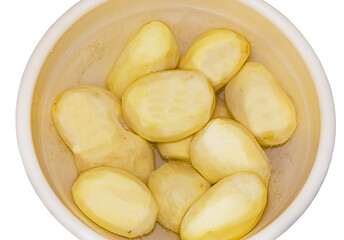 Plastic container with peeled and cut potatoes