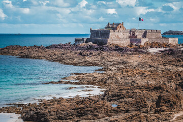 Historic coastal fortress on rocky shores in Saint-Malo, France