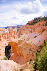 Bryce Canyon’s Natural Bridge Arch and Towering Orange Cliffs