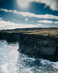 Rugged coastal cliffs and crashing waves at Arnarstapi, Snæfellsnes Peninsula, West Iceland...