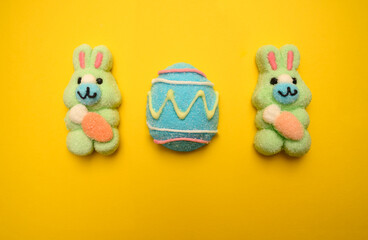 themed marshmallow bunnies and pastel Easter eggs on a bright yellow background. A perfect festive composition for Easter clipart, religious Easter decor, and digital designs