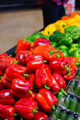  Colorful display of fresh bell peppers at a grocery store