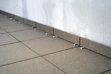 Laying floor tiles. Not yet grouted.