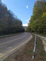 paved highway in a mountainous area in early autumn with panoramic views