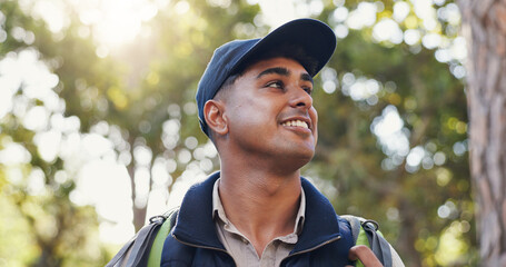 Smile, thinking and man hiking in forest of backpacking, travel adventure and environment fitness. Below, male person and trekking hobby in woods, nature survival and sightseeing on vacation activity