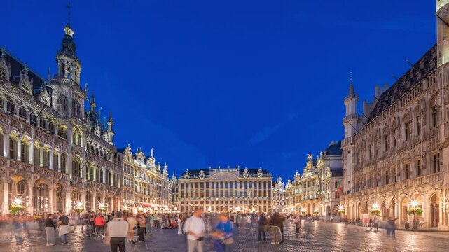 The Grand-Place (Grote Markt) day to night transition timelapse hyperlapse in Brussels, Belgium. Brabantine Gothic Town Hall, Maison Grand-Place and tourists in the historic city center after sunset