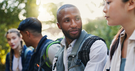 Hiking, nature and people with discussion, travel and relax with weekend break, hobby and adventure. Healthy, outdoor and friends with conversation, calm and fitness with smile and group in forest