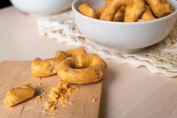 Artisanal homemade typical apulian taralli, used as a baked snack in south italian culture.
