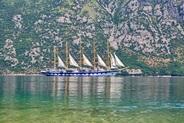 Amazing landscape view of the mountains and the sea and sailing yacht