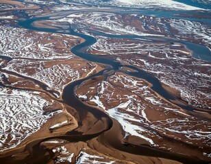 GeneratTitle: Aerial View of a Partially Frozen River with Intricate Natural Patterns
