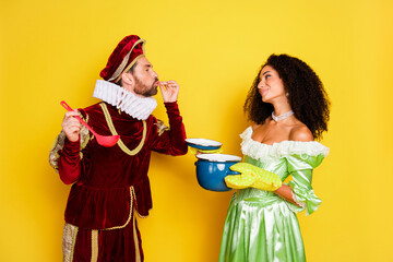 Colorful playful depiction of a couple in historic-themed costumes with a vibrant yellow background