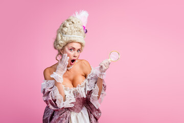 Elegant baroque-costumed lady holding a magnifying glass in a historical style with a pink background