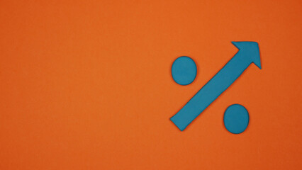 Blue arrow on orange background transforming into a percentage sign.