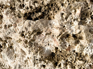 Textured surface of a natural stone with unique patterns and mineral deposits