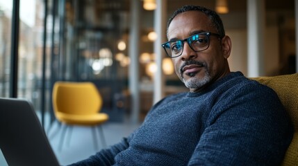 Man using laptop in office setting