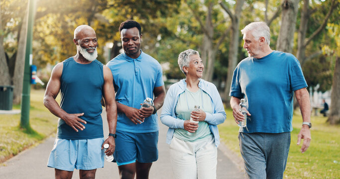 People, talking and walking for fitness outdoor with mobility training, discussion and morning routine. Senior, community and coach of conversation, exercise and motivation for cardio workout at park