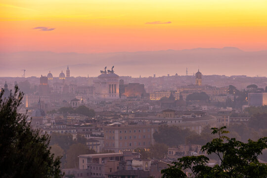 Vibrant sunrise over the city of Rome seen from the Terrazza del Gianicolo and Piazzale Giuseppe Garibaldi. Cityscape of the Capital of Italy