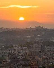 Vibrant sunrise over the city of Rome seen from the Terrazza del Gianicolo and Piazzale Giuseppe Garibaldi. Cityscape of the Capital of Italy