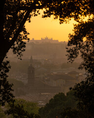 Vibrant sunrise over the city of Rome seen from the Terrazza del Gianicolo and Piazzale Giuseppe Garibaldi. Cityscape of the Capital of Italy
