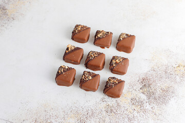 Handmade chocolate with pistachios, dark and milk chocolate pieces.