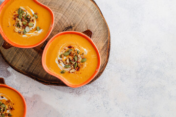 Traditional autumn butternut squash soup with seeds.