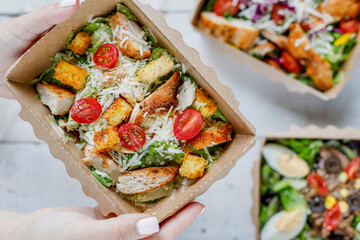 Healthy salads in plastic package for take away or food delivery.