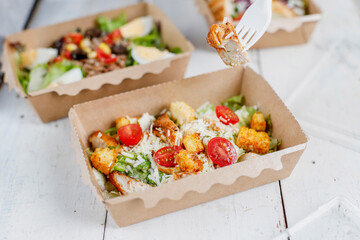 Healthy salads in plastic package for take away or food delivery.