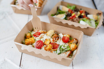 Healthy salads in plastic package for take away or food delivery.