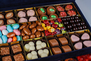 Handmade chocolate with pistachios, dark and milk chocolate pieces.