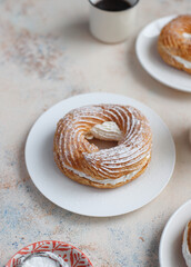 Cream puffs with whipped cream and sour cherries.